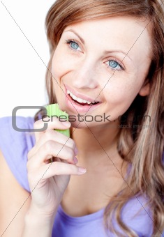 Cheerful young woman eating celery 