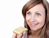 Cheerful woman eating a cracker with cheese 