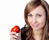 Attractive woman holding a tomato 