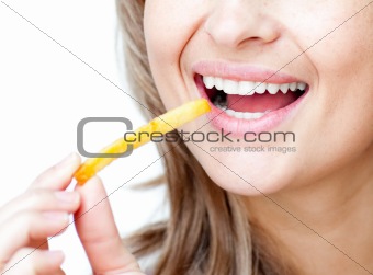 Close-up of a smiling woman eating fries 