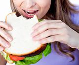 Close-up of a woman eating a sandwich 
