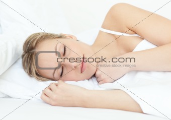 Attractive woman sleeping on a bed