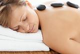 Relaxed woman lying on a massage table 