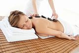 Delighted woman lying on a massage table