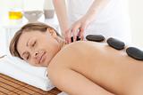 Bright woman relaxing on a massage table