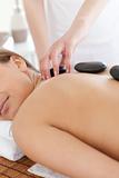 Delighted woman relaxing on a massage table