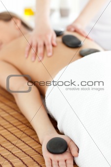 Close-up of a bright woman relaxing on a massage table 
