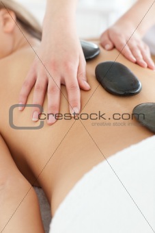 Close-up of a delighted woman relaxing on a massage table 