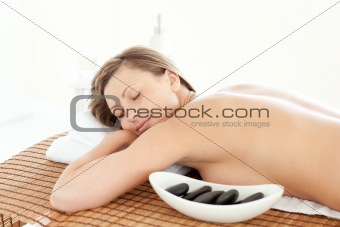 Portrait of a pretty woman having a massage with stones