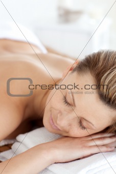 Close-up of a young woman having a massage with stones