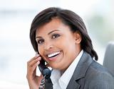 Portrait of a radiant business woman talking on phone