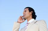 Portrait of an handsome business man using a cellphone