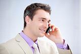 Positive businessman talking on phone