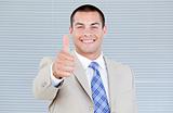 Cheerful businessman with a thumb up 