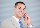Assertive businessman talking on phone