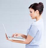 Confident businesswoman using a laptop