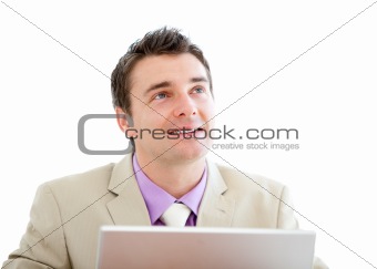 Pensive businessman using a laptop 