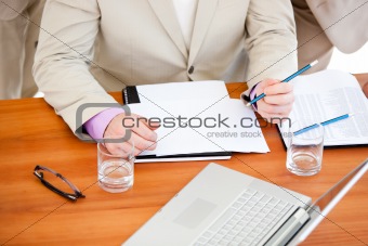 Close-up of a businessman working in a meeting