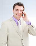 Smiling businessman talking on phone