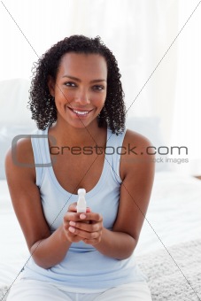 Smiling woman finding out results of a pregnancy test 