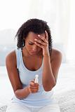 Upset woman finding out results of a pregnancy test 