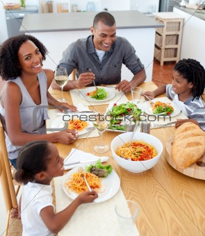 Happy family dining together