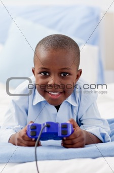 Cute little boy playing video game