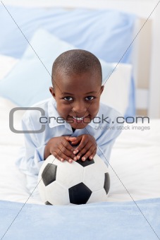 Little boy holding a soccer ball