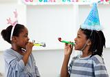 Happy siblings having fun at a birthday party 