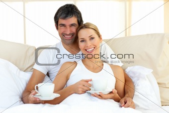 Attractive woman and her boyfriend drinking coffee