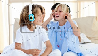Joyful children having fun and listening music