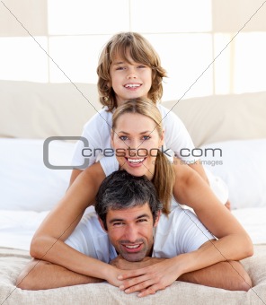 Little boy and his parents playing 