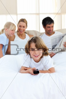 Enthusiastic little boy holding a remote 
