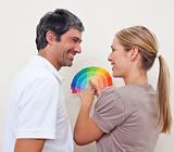 Couple with color samples to paint their new appartment