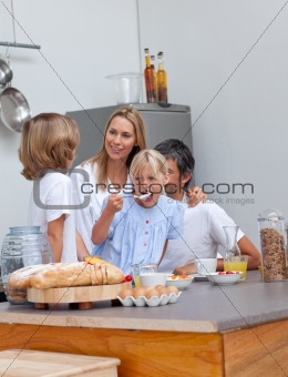 Jolly family having breakfast