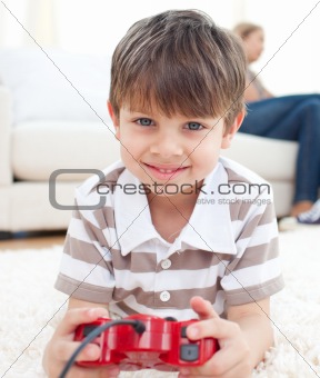 Close-up of little boy playing video games