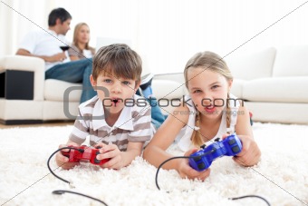 Siblings playing video games together
