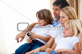 Young Family watching TV 