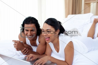 Happy couple surfing the internet