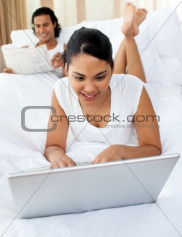 Lovers relaxing on the bed 