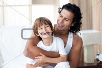 Cute little boy having fun with his father