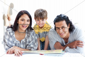 Happy family reading book together