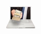 Businessman Handing Stack of Money Through Laptop Screen Isolated on a White Background.