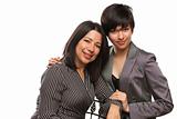 Attractive Multiethnic Mother and Daughter Portrait Isolated on a White Background.