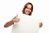 Smiling Young Man with Thumbs Up Holding Blank White Sign Isolated on a White Background.