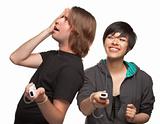 Diverse Couple with Video Game Controllers Having Fun Isolated on a White Background.
