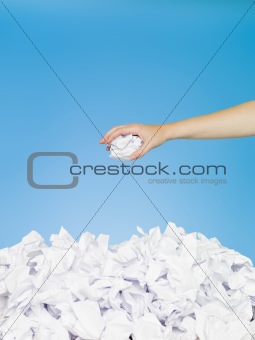 Human trowing a paper