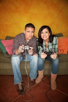 Hispanic Couple Playing Video game