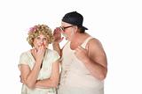 Man sharing a secret with a woman on white background
