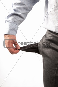 Disappointed businessman with empty pockets isolated over white 
